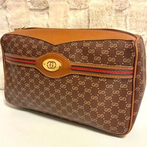 Gucci Brown and Tan Cosmetic Case with Signature Pattern